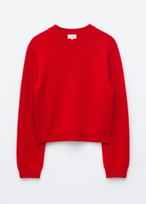 Red cashmere-blend jumper laid flat, featuring a round neckline, long sleeves, ribbed cuffs and hem, and gently dropped shoulders.