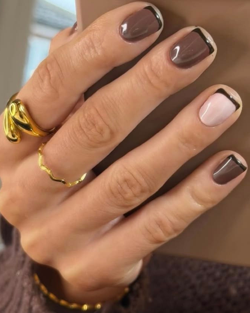 Dark brown and nude gel manicure featuring short square nails with thin micro french tips. Short nail designs