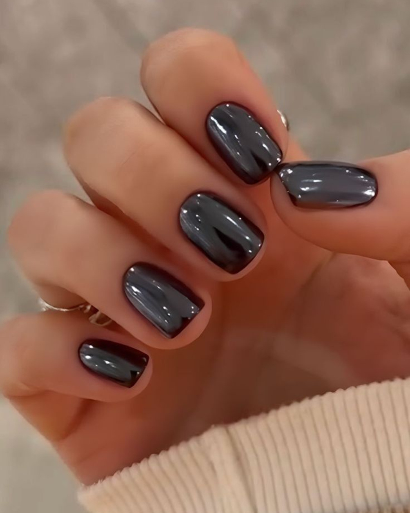Short, square to squoval nails with glossy gunmetal grey chrome mirror finish short nail design